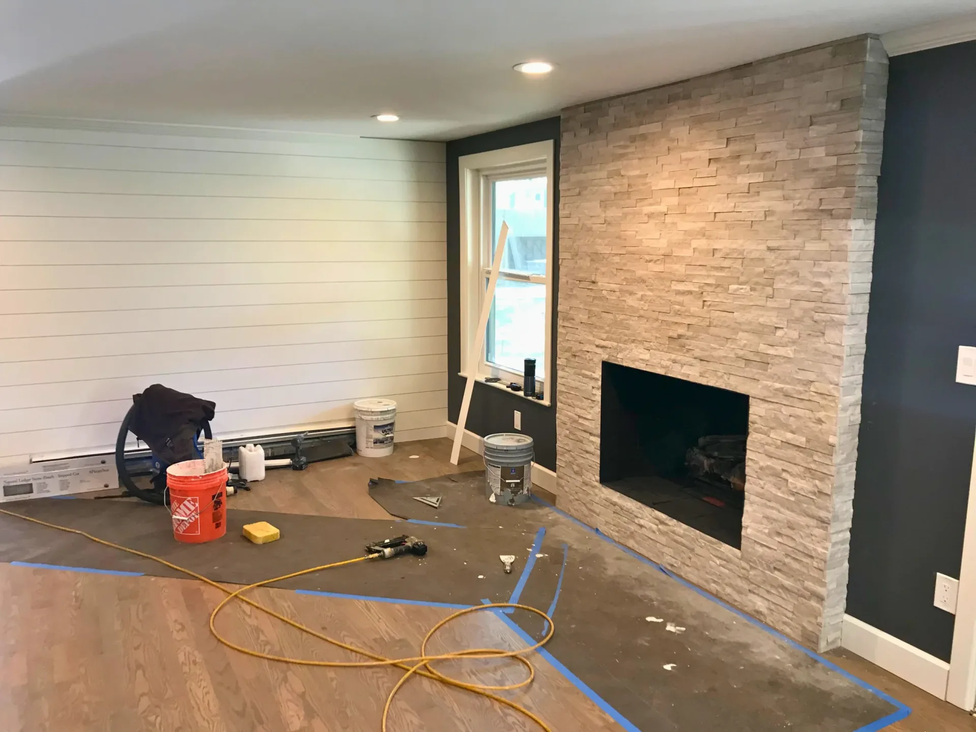 Aspen Floor & Home Services crew installing hardwood on a Denver job site