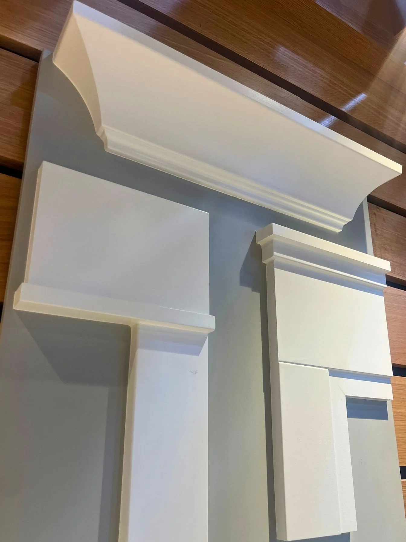 Custom white trim and mantel carpentry detail