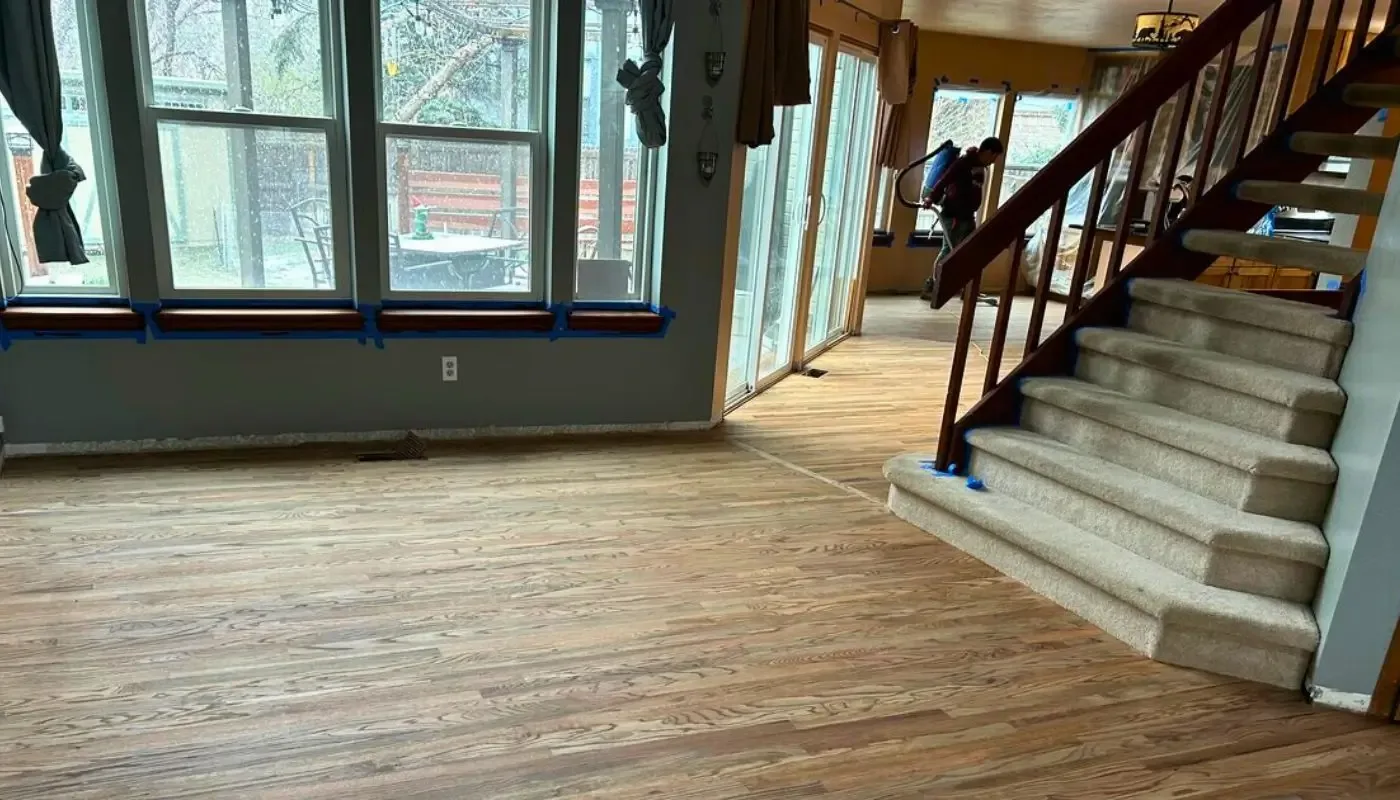 Living area and staircase masked off with tape while the floor is finished