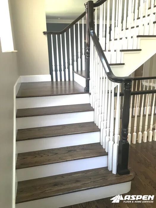 Stair treads with painted risers and iron balusters