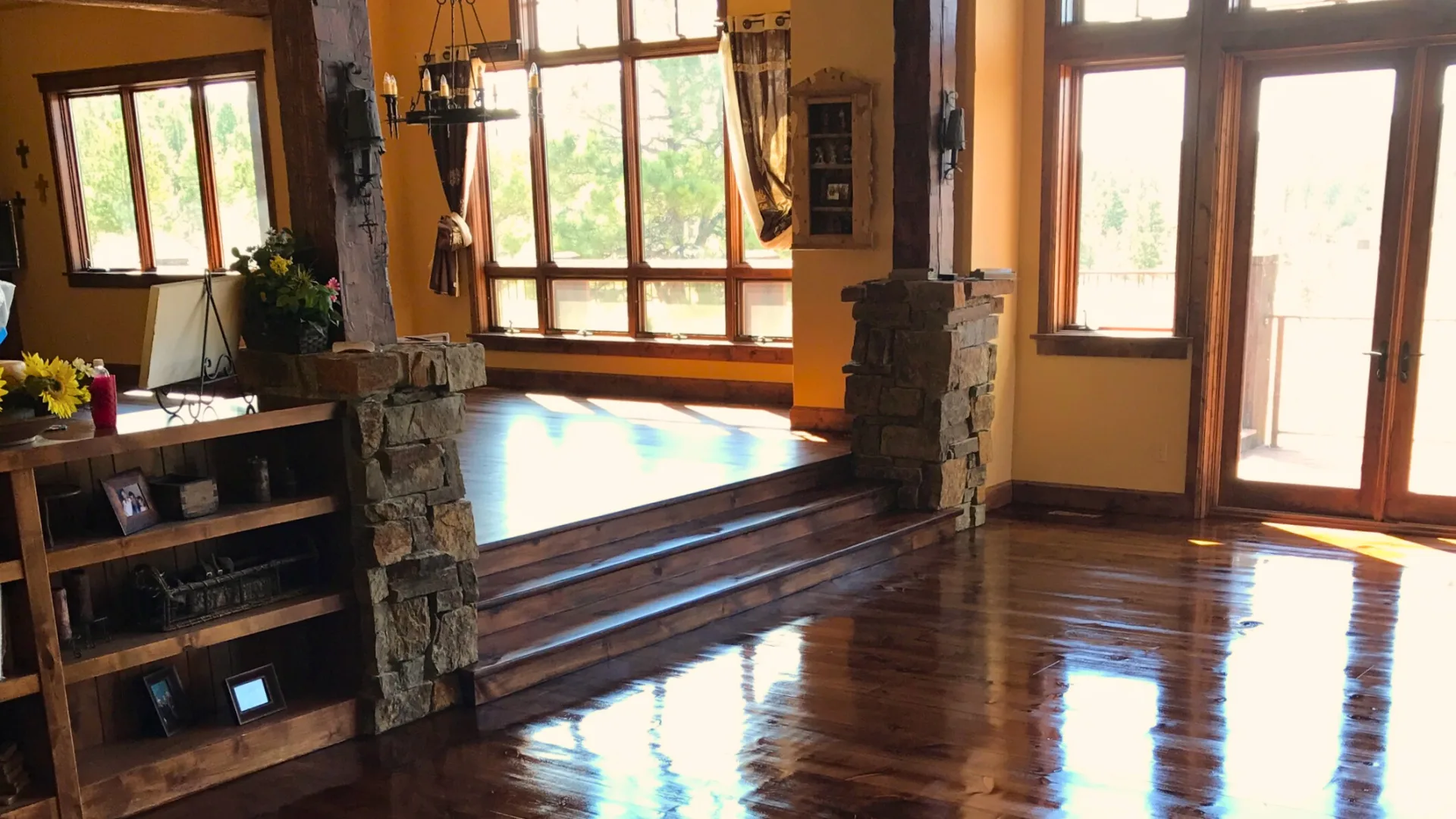 New hardwood floor meeting a stone surround