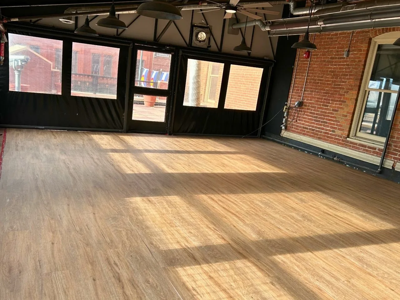Wood floor in a brick-walled commercial space
