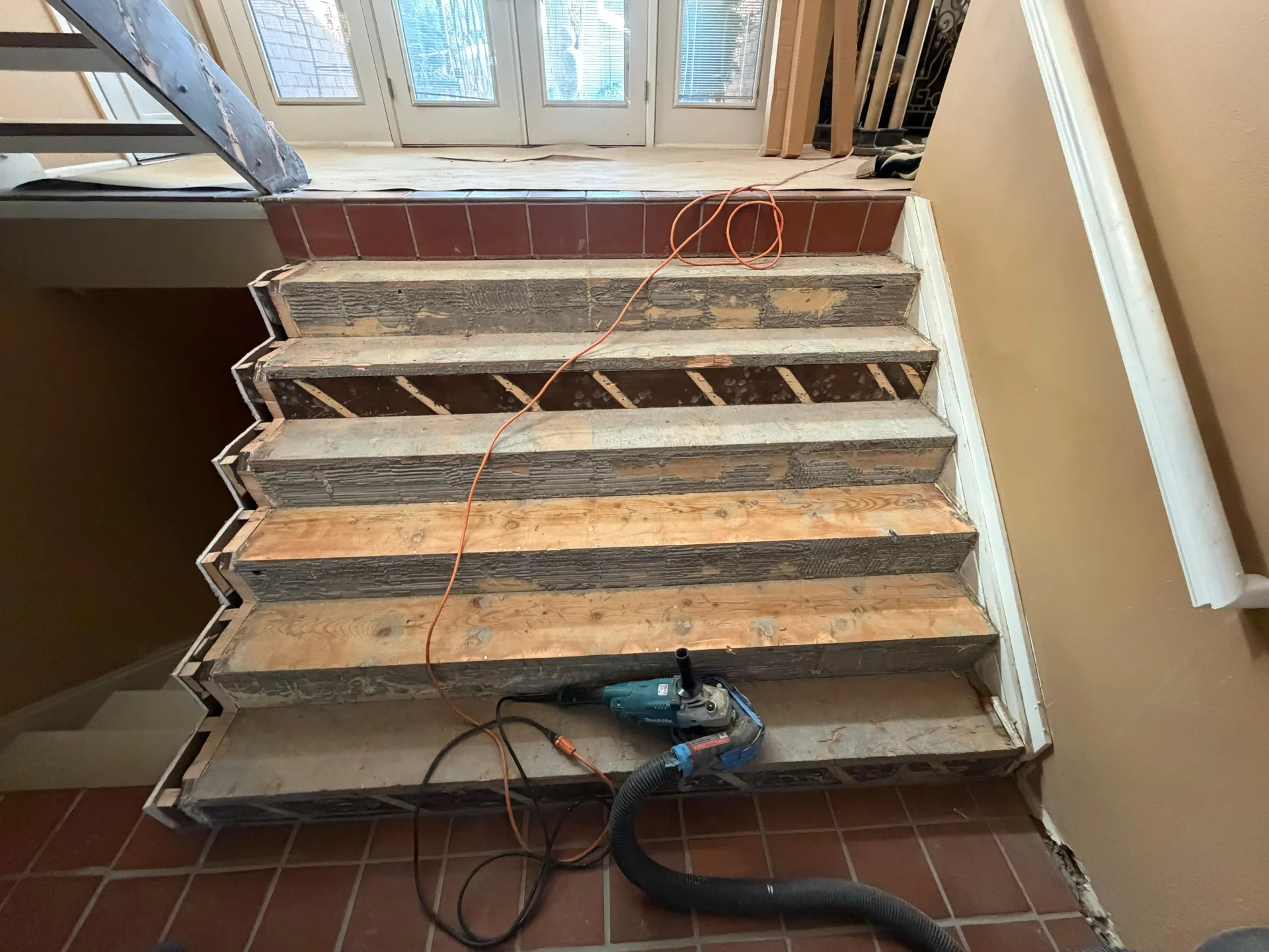 Staircase stripped back to the bare stringers after the old treads came off