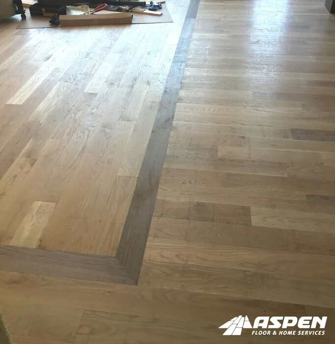 Replacement boards blended into an existing wood floor