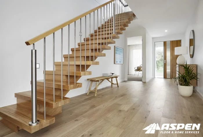 Staircase with light wood treads and metal balusters