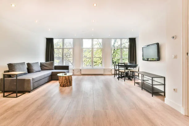 Beautiful unfinished hardwood floor enhancing a bright, modern living room