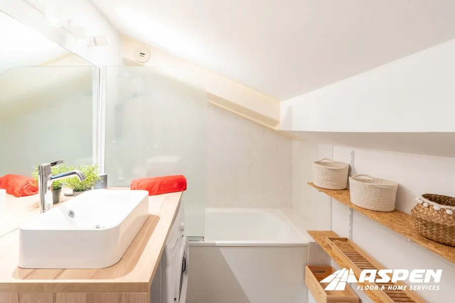 Remodeled bathroom with a vessel sink and a built-in tub