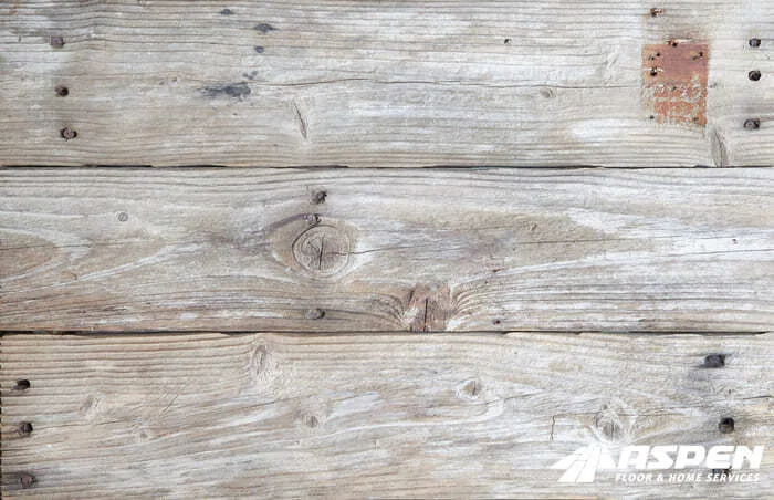 Weathered hardwood boards before repair
