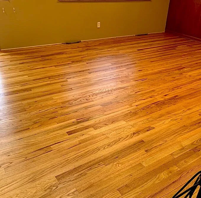 Refinished floor after a repair, blended into the original wood