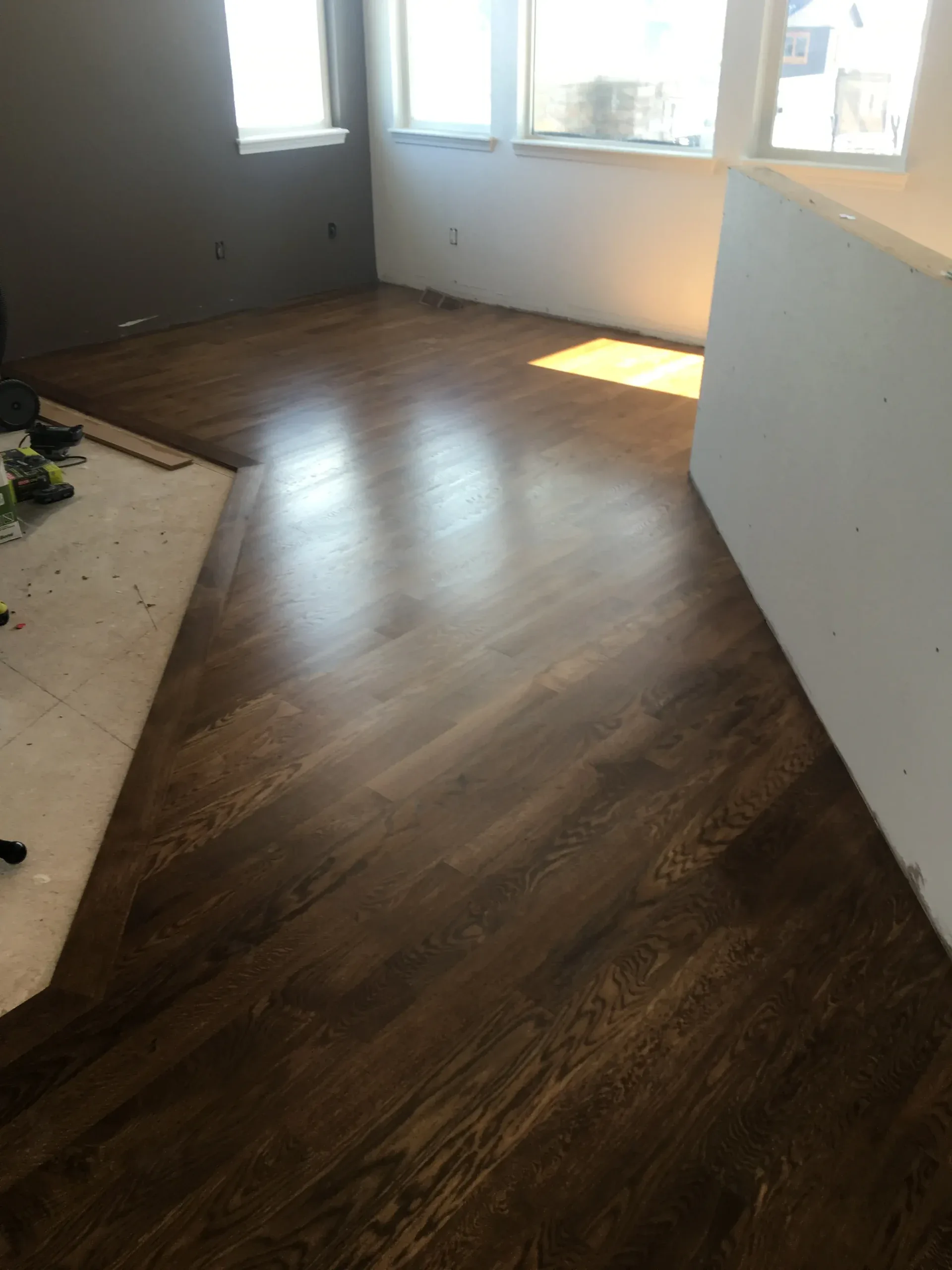 Dark wood floor part way through installation