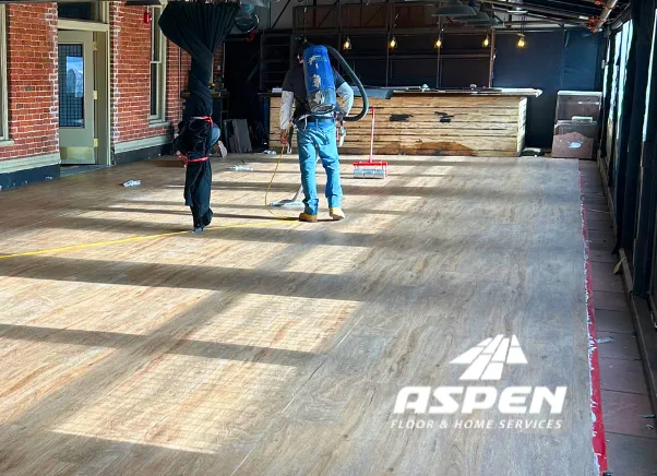 Aspen crew installing wood flooring in a commercial space