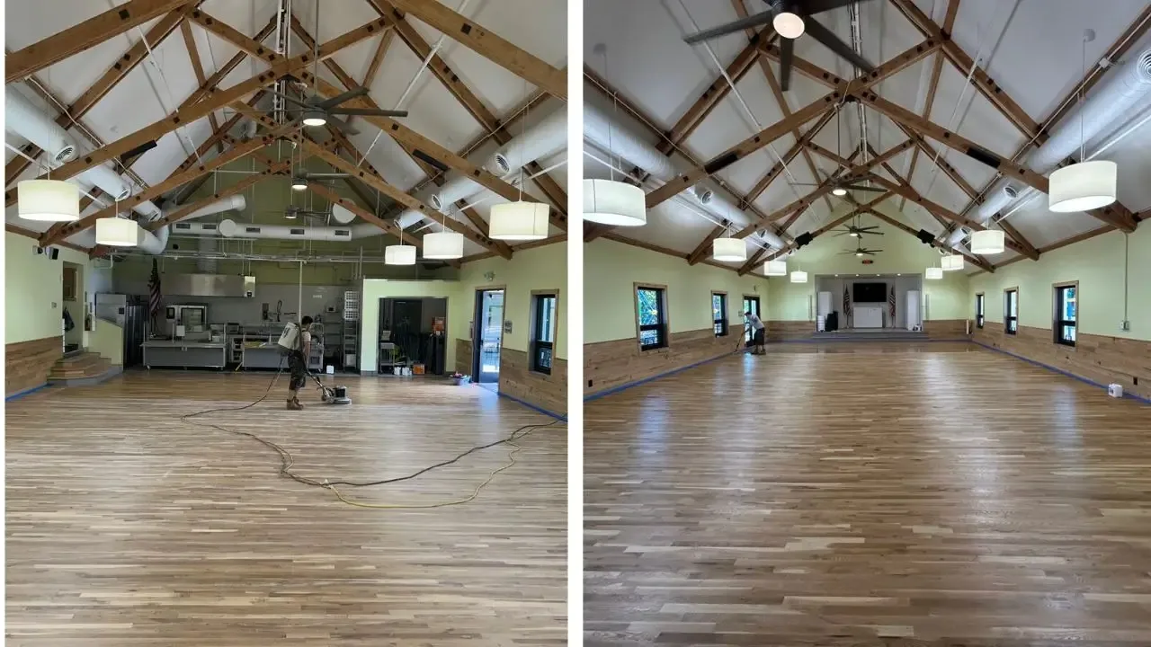 Wide wood floor refinished in a vaulted community hall