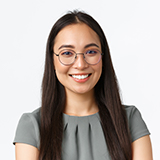 Smiling woman with long dark hair and glasses, wearing a gray blouse, representing customer satisfaction in hardwood floor refinishing services.