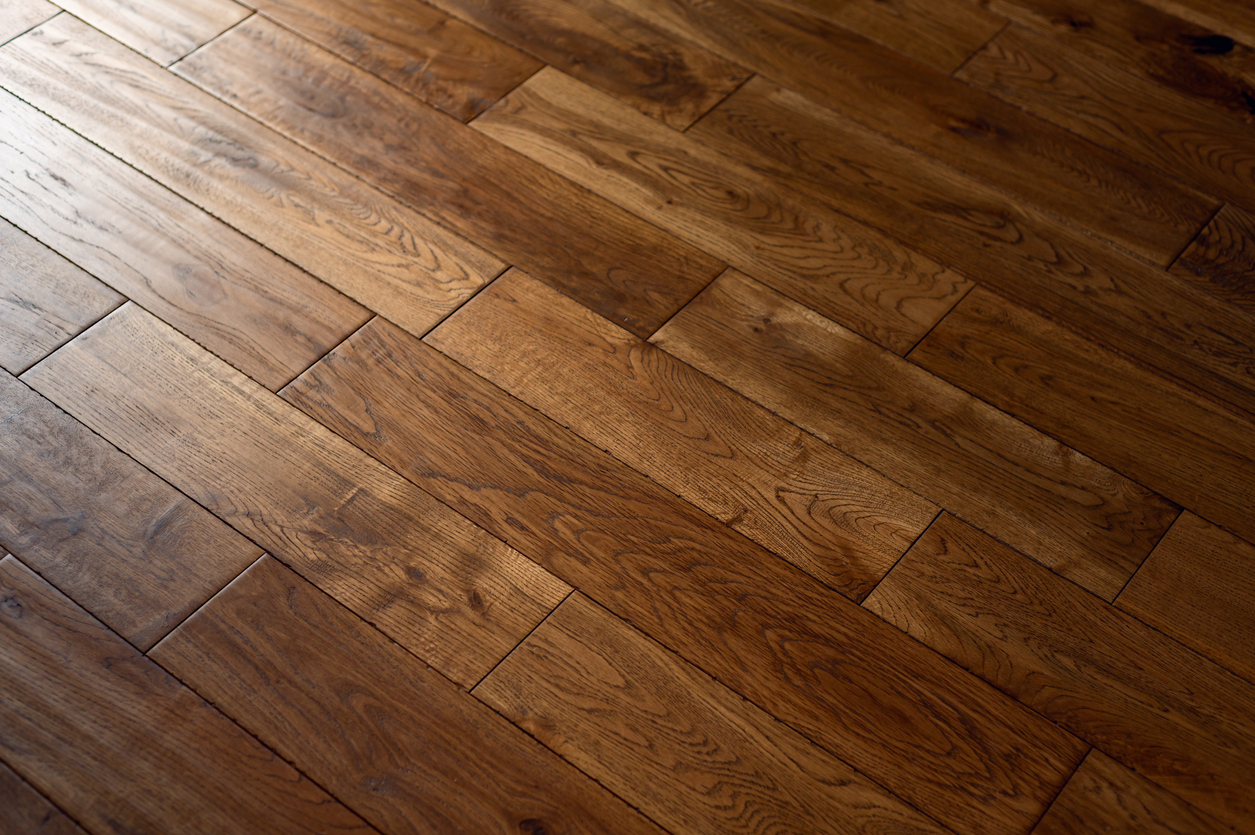 A beautiful new hardwood floor in a home, showcasing the rich color and grain of the wood