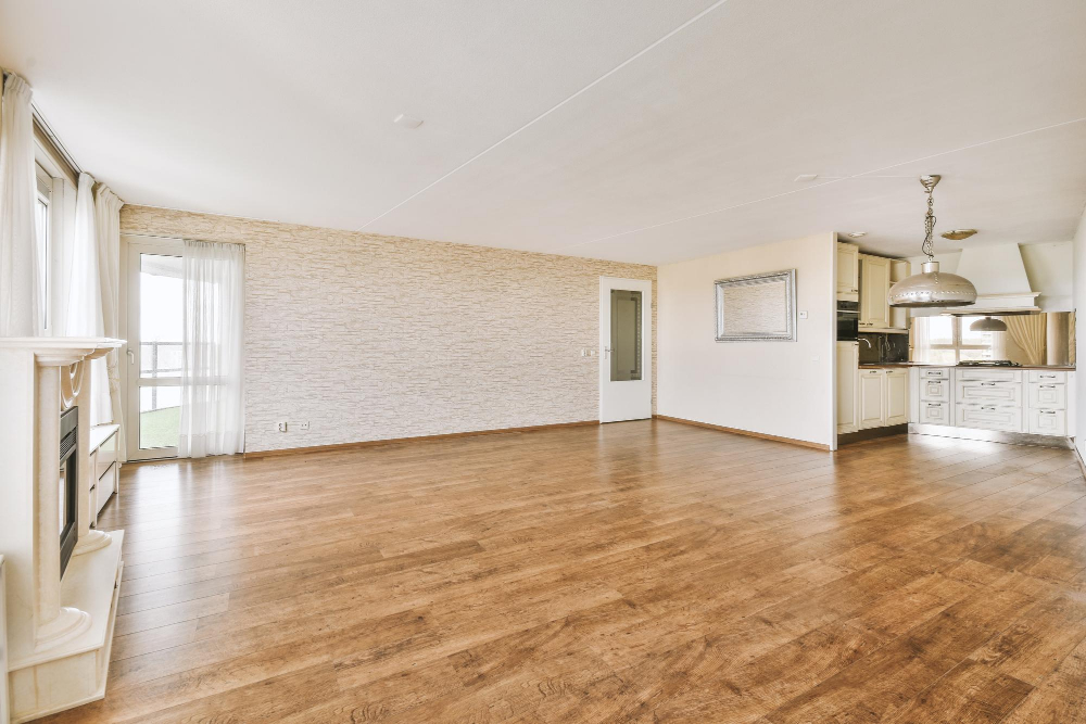 Spacious room with beautifully finished hardwood flooring