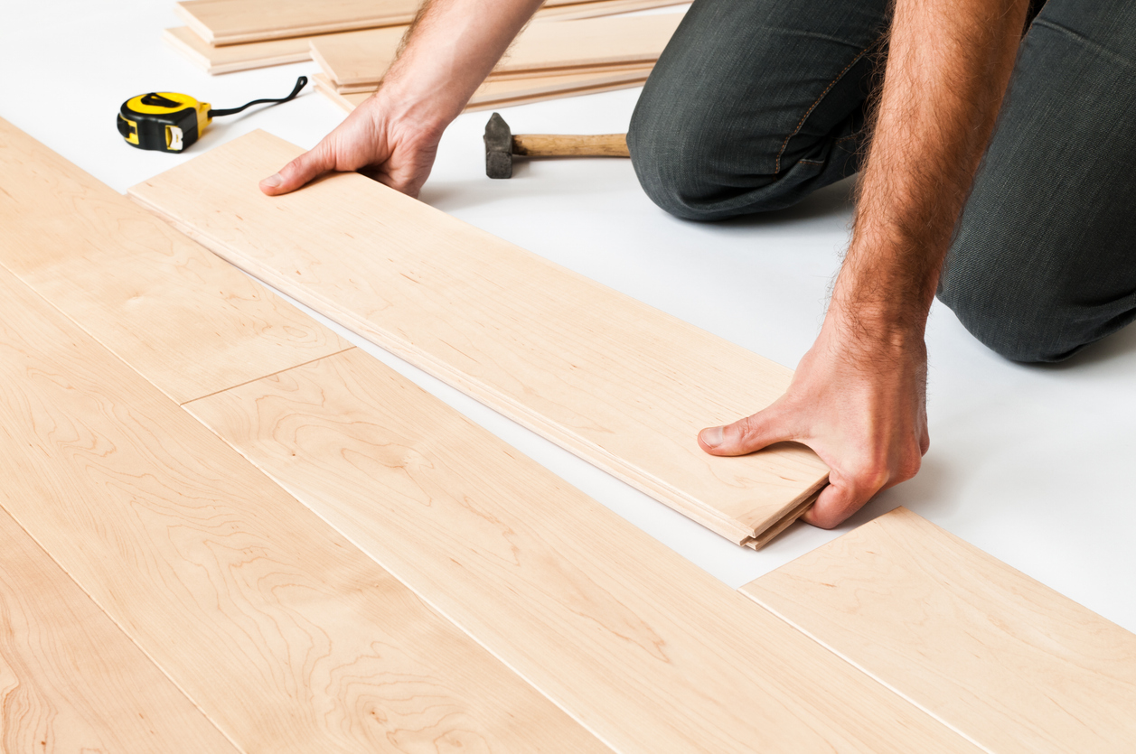 Closeup of hardwood floor installation highlighting precision and proper techniques