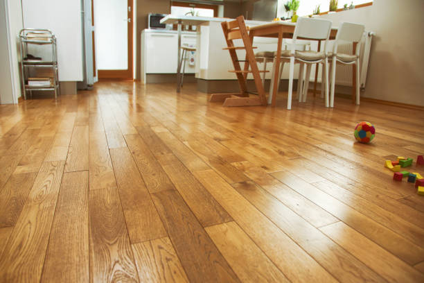 Closeup of a perfectly installed engineered hardwood floor in a kitchen