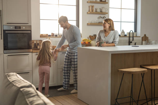 Family Enjoying Quality Time in Their Contemporary Remodeled Kitchen