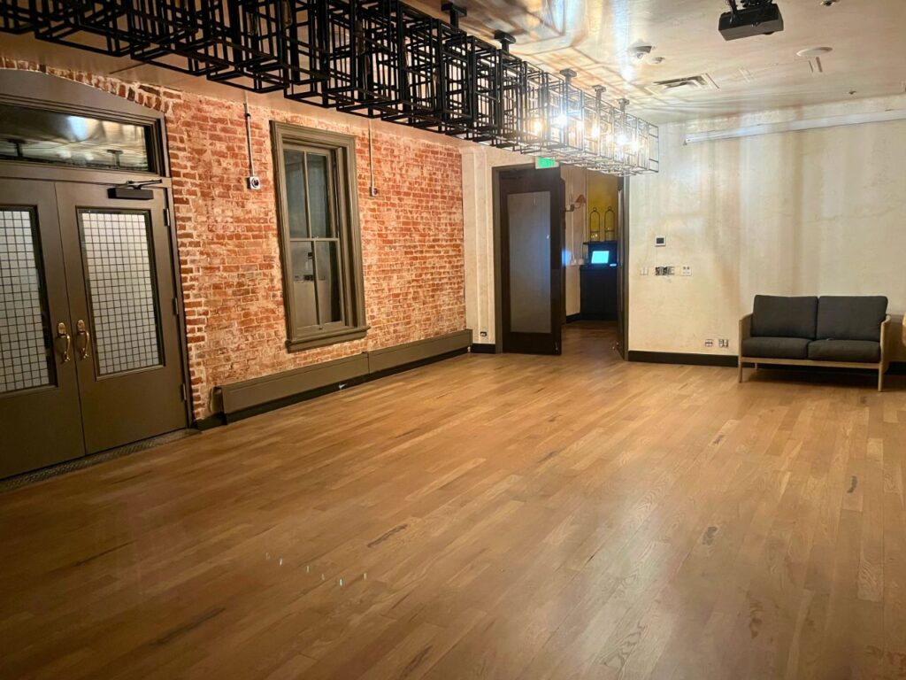 Installing walnut hardwood flooring in upscale Cherry Creek North restaurant dining room with commercial-grade protective finish
