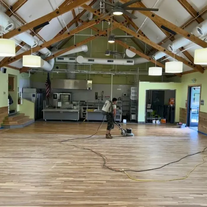 Commercial hardwood flooring refinishing project in Denver event hall entrance